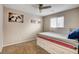 Bedroom with plush carpet and a vibrant bed with drawers, under a ceiling fan at 9846 Sunriver Meadows Ave, Las Vegas, NV 89148