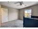 Bedroom with window views, neutral carpet and paint, and a full bed at 9846 Sunriver Meadows Ave, Las Vegas, NV 89148