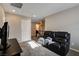 Spacious bonus room with comfortable seating and ample natural light, perfect for relaxation at 9846 Sunriver Meadows Ave, Las Vegas, NV 89148