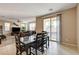 Bright dining room with backyard views and open to the living room at 9846 Sunriver Meadows Ave, Las Vegas, NV 89148