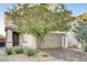 Charming two-story home with a desert landscaped front yard and a two-car garage at 9846 Sunriver Meadows Ave, Las Vegas, NV 89148