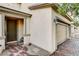 View of the home's entrance with brick paver walkway and a two-car garage at 9846 Sunriver Meadows Ave, Las Vegas, NV 89148