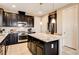 Modern kitchen featuring stainless steel appliances and granite countertops at 9846 Sunriver Meadows Ave, Las Vegas, NV 89148