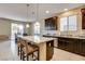 Stylish kitchen with an island and adjacent dining area at 9846 Sunriver Meadows Ave, Las Vegas, NV 89148