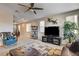 Bright living room with comfortable seating, large TV, and stylish accents at 9846 Sunriver Meadows Ave, Las Vegas, NV 89148