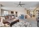 Spacious living room open to the kitchen and dining area with neutral paint and carpet at 9846 Sunriver Meadows Ave, Las Vegas, NV 89148