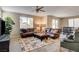 Inviting living room featuring a plush leather sectional and neutral decor at 9846 Sunriver Meadows Ave, Las Vegas, NV 89148