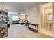 Open-concept living area flows into a half bath with tile flooring and modern fixtures at 9846 Sunriver Meadows Ave, Las Vegas, NV 89148