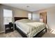 Lovely main bedroom featuring carpeted floors, large windows and access to ensuite bathroom at 9846 Sunriver Meadows Ave, Las Vegas, NV 89148