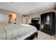 Inviting main bedroom with dark furniture set, carpeted floors and an airy feel at 9846 Sunriver Meadows Ave, Las Vegas, NV 89148