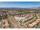 Aerial view showcasing the neighborhood and location of 1017 Guided Dancer Ave in a sunny, desert landscape at 1017 Guided Dancer Ave, Henderson, NV 89015