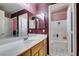 Bright bathroom featuring a long vanity with double sinks, and shower-over-tub at 1017 Guided Dancer Ave, Henderson, NV 89015