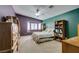 Well-lit bedroom with bay window and window seat featuring built-in bookshelves at 1017 Guided Dancer Ave, Henderson, NV 89015