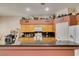 Charming kitchen with oak cabinets, granite counters, an inviting breakfast bar, and ample storage space at 1017 Guided Dancer Ave, Henderson, NV 89015