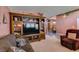 Open concept living room with wooden entertainment center at 1017 Guided Dancer Ave, Henderson, NV 89015