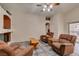Cozy living room with three recliners and a fireplace at 1017 Guided Dancer Ave, Henderson, NV 89015