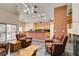 Open-concept living room featuring tiled flooring, neutral walls, and a view into the kitchen at 1017 Guided Dancer Ave, Henderson, NV 89015