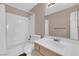 Bright bathroom featuring a shower-tub combo and a neutral-toned single sink vanity at 104 Hutton Ln, Las Vegas, NV 89145