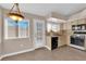 Dining area with tile floors, pendant lighting, access to kitchen with stainless appliances, and access to backyard at 104 Hutton Ln, Las Vegas, NV 89145
