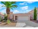 Charming single-story home with a well-maintained yard and attached two car garage at 104 Hutton Ln, Las Vegas, NV 89145