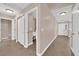 Inviting hallway with tile flooring, closet space, and access to the home's amenities at 104 Hutton Ln, Las Vegas, NV 89145