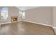 Spacious living room featuring a cozy fireplace, large windows and new floors at 104 Hutton Ln, Las Vegas, NV 89145