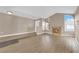 Open living room featuring a cozy fireplace, large windows and new floors at 104 Hutton Ln, Las Vegas, NV 89145