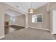 Open living room featuring a cozy fireplace, large windows and new floors at 104 Hutton Ln, Las Vegas, NV 89145