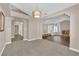 Open living room featuring a cozy fireplace, large windows and new floors at 104 Hutton Ln, Las Vegas, NV 89145