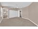 The main bedroom features neutral paint, carpet floors, ceiling fan, closet, and easy access to an ensuite bathroom at 104 Hutton Ln, Las Vegas, NV 89145