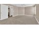 The main bedroom features neutral paint, carpet floors, ceiling fan, and easy access to an ensuite bathroom at 104 Hutton Ln, Las Vegas, NV 89145