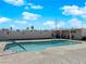 Inviting swimming pool area with a covered patio and ample space for relaxation at 104 Hutton Ln, Las Vegas, NV 89145