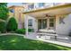 A covered patio with ceiling fan and a comfortable seating arrangement provides a relaxing outdoor space at 10749 Turquoise Valley Dr, Las Vegas, NV 89144