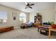 Comfortable bedroom with two twin beds, ceiling fan, and natural light from large window at 10749 Turquoise Valley Dr, Las Vegas, NV 89144