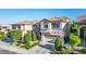 Charming two-story home with a well-manicured lawn, and beautiful landscaping at 10749 Turquoise Valley Dr, Las Vegas, NV 89144