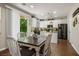 Eat-in kitchen with stainless steel appliances and wooden table and seating at 10749 Turquoise Valley Dr, Las Vegas, NV 89144