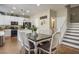 Bright eat-in kitchen area with stainless steel appliances and stylish staircase at 10749 Turquoise Valley Dr, Las Vegas, NV 89144
