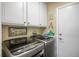 Functional laundry room featuring modern appliances and ample storage space at 10749 Turquoise Valley Dr, Las Vegas, NV 89144