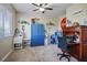 Bright office featuring a desk, blue cabinet, shelving, and natural light at 10749 Turquoise Valley Dr, Las Vegas, NV 89144
