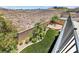 Enclosed backyard featuring a small private pool, manicured lawn, and stylish landscaping with mature palms at 1134 Pandora Canyon St, Henderson, NV 89052