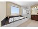Luxurious bathroom featuring a soaking tub, walk-in shower with glass door, and a dual sink vanity with granite countertop at 1134 Pandora Canyon St, Henderson, NV 89052