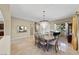 Formal dining room with chandelier, complemented by elegant decor and natural light at 1134 Pandora Canyon St, Henderson, NV 89052