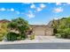 Charming two-story home with a three-car garage and a well-manicured front yard at 1134 Pandora Canyon St, Henderson, NV 89052
