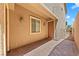 Charming covered front porch with neutral colored walls and stylish brick pavers at 1134 Pandora Canyon St, Henderson, NV 89052