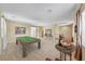 Open game room with a pool table and elegant decor, ideal for entertaining and leisure at 1134 Pandora Canyon St, Henderson, NV 89052