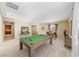 Spacious game room with a billiard table, offering a perfect spot for entertainment and relaxation at 1134 Pandora Canyon St, Henderson, NV 89052