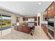 Gourmet kitchen with a large island, stainless steel appliances, and a view of the outdoor patio at 1134 Pandora Canyon St, Henderson, NV 89052