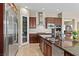 Spacious kitchen features stainless steel appliances, large island with sink, and stylish cabinets at 1134 Pandora Canyon St, Henderson, NV 89052