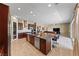 Open-concept kitchen with a large island, stainless steel appliances, and abundant cabinet space at 1134 Pandora Canyon St, Henderson, NV 89052