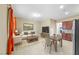 Bright and airy living area adjacent to modern kitchen with stainless steel appliances and dining area at 1134 Pandora Canyon St, Henderson, NV 89052